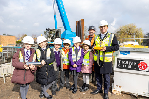 Chairman and children on site with the time capsule