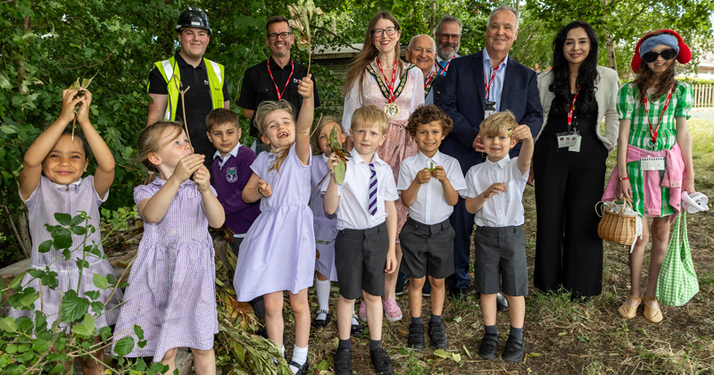 Epping Primary School pupils with EFDC councillors and Pellikaan staff in front of the new bug hotel