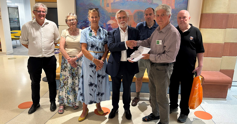 Cllr Ken Williamson receiving petition from Epping Society