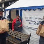 EFDC staff collecting food from local butchers for food parcels for resident