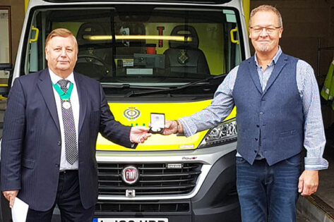 John Rout receiving the Community service medal for East of England Ambulance Service from Cllr Richard Bassett