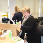 Cllr Helen Kane helping volunteers sort through donations