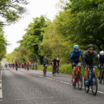 Cyclists in the RideLondon-Essex sportive pass through Epping Forest