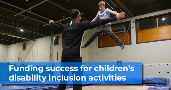 Funding-success-for-childrens-disability-inclusion-activities. Child bouncing on trampoline with instructor