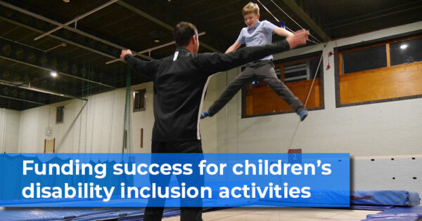 Funding-success-for-childrens-disability-inclusion-activities. Child bouncing on trampoline with instructor