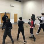 Youth club members taking part in boxing workshop