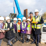 Chairman and children on site with the time capsule